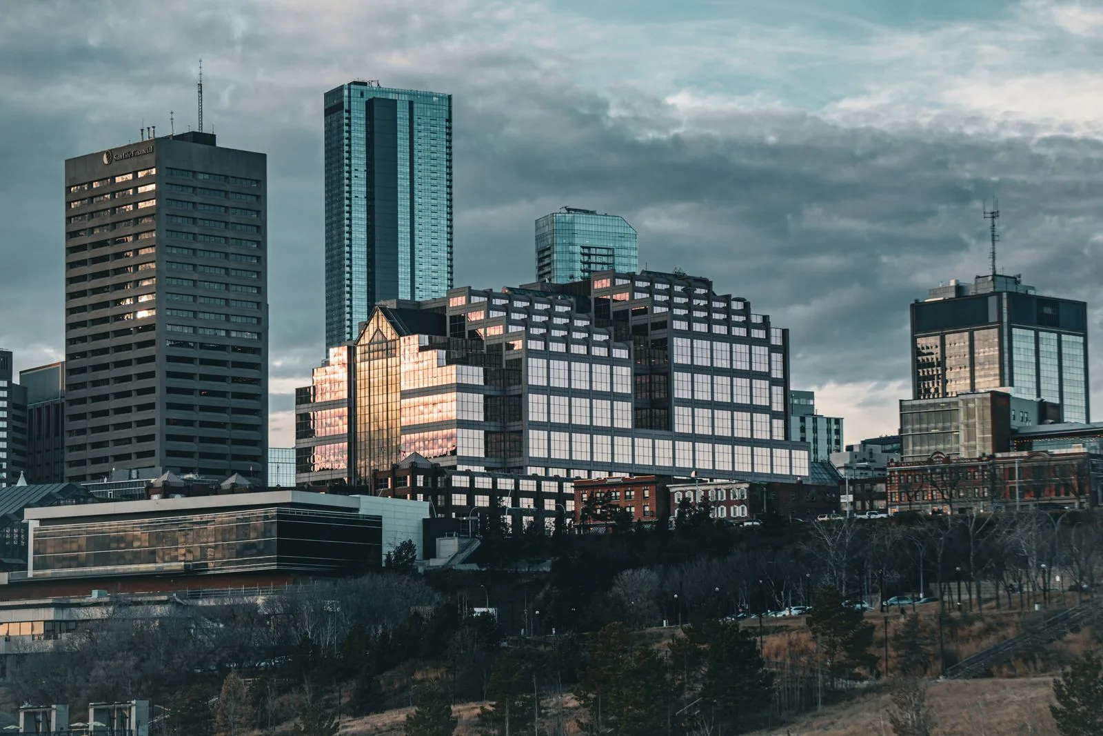 A modern city skyline under a cloudy sky