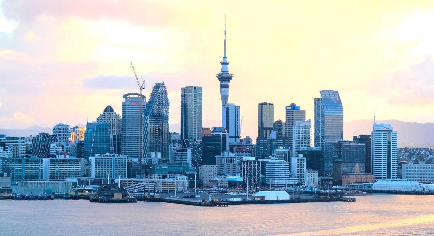 The Auckland skyline and Sky Tower across the harbour at sunset