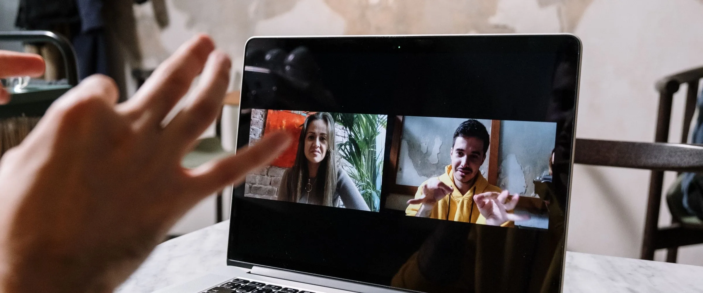 A video call on a laptop screen