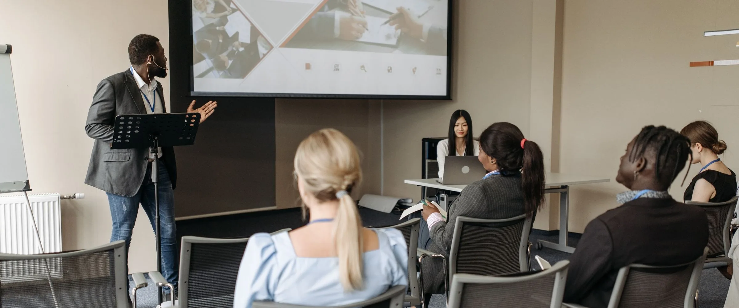 A presenter leading a workshop in a seminar room