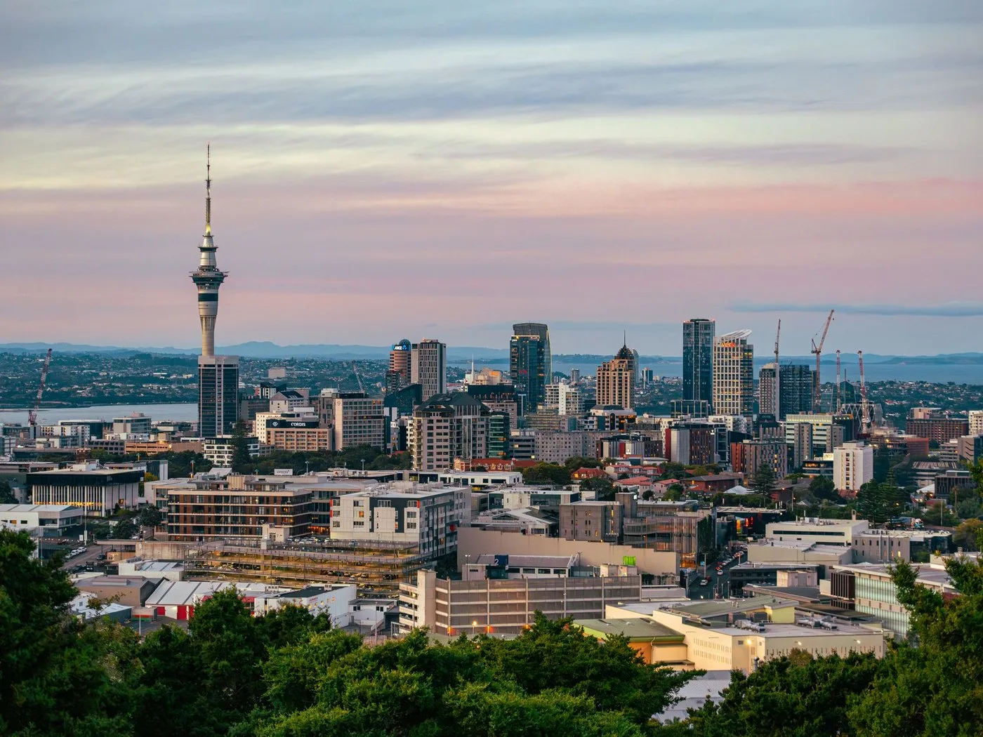 Auckland city skyline with the Sky Tower at dusk
